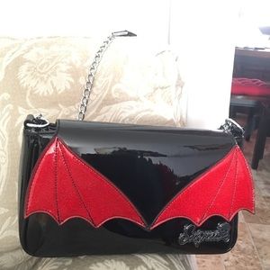 Sourpuss red bat wing purse